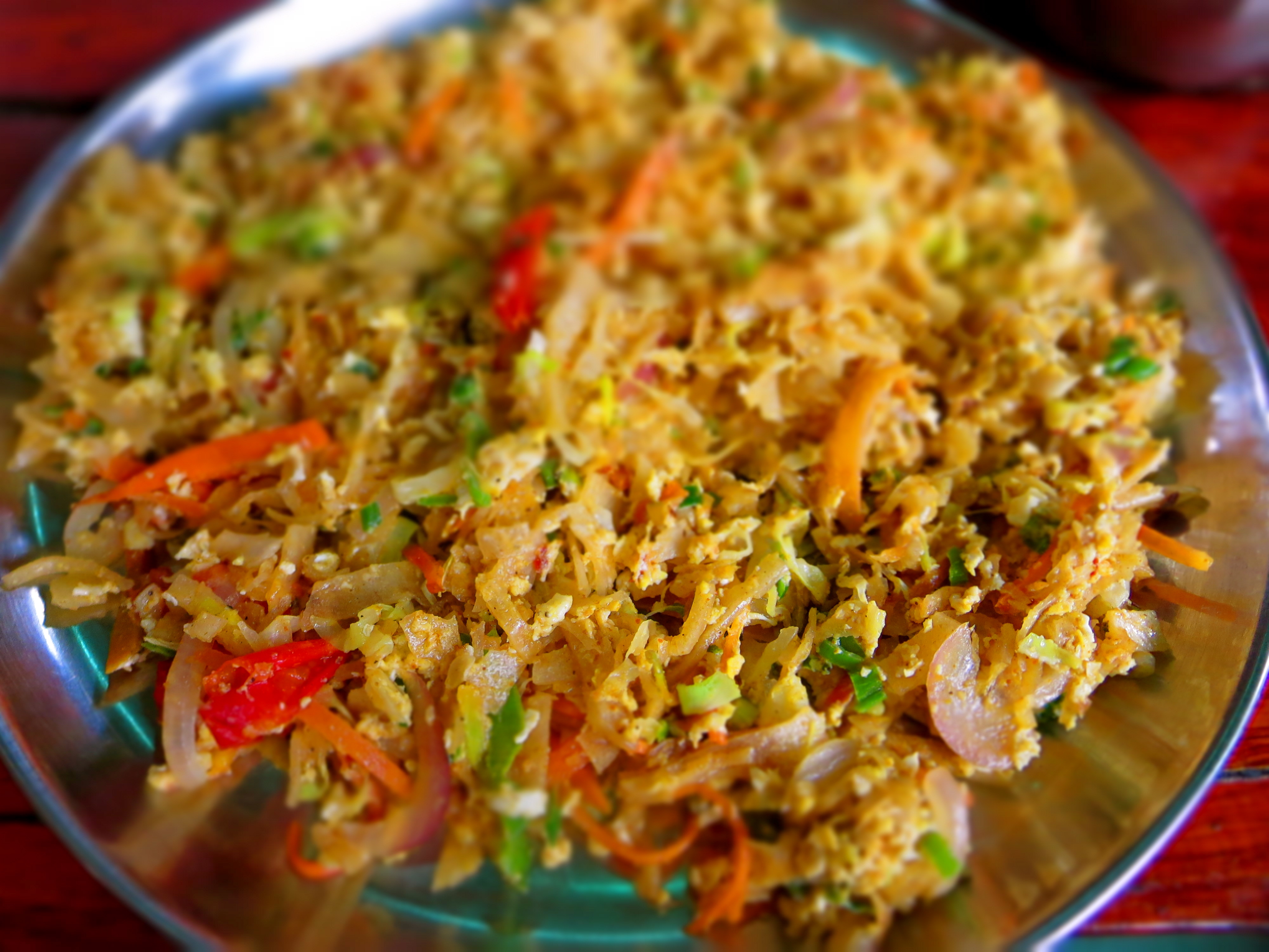 <br/>Sliced roti pieces fried and mixed with meat and vegetables<br/><br/>Ingredients<br/>Rice flour, Coconut oil, Chicken, Lamb, Beef, Seasonal vegetables, Salt, Pepper, Red Onions, Green Chillies, Turmeric powder, Chilli flakes