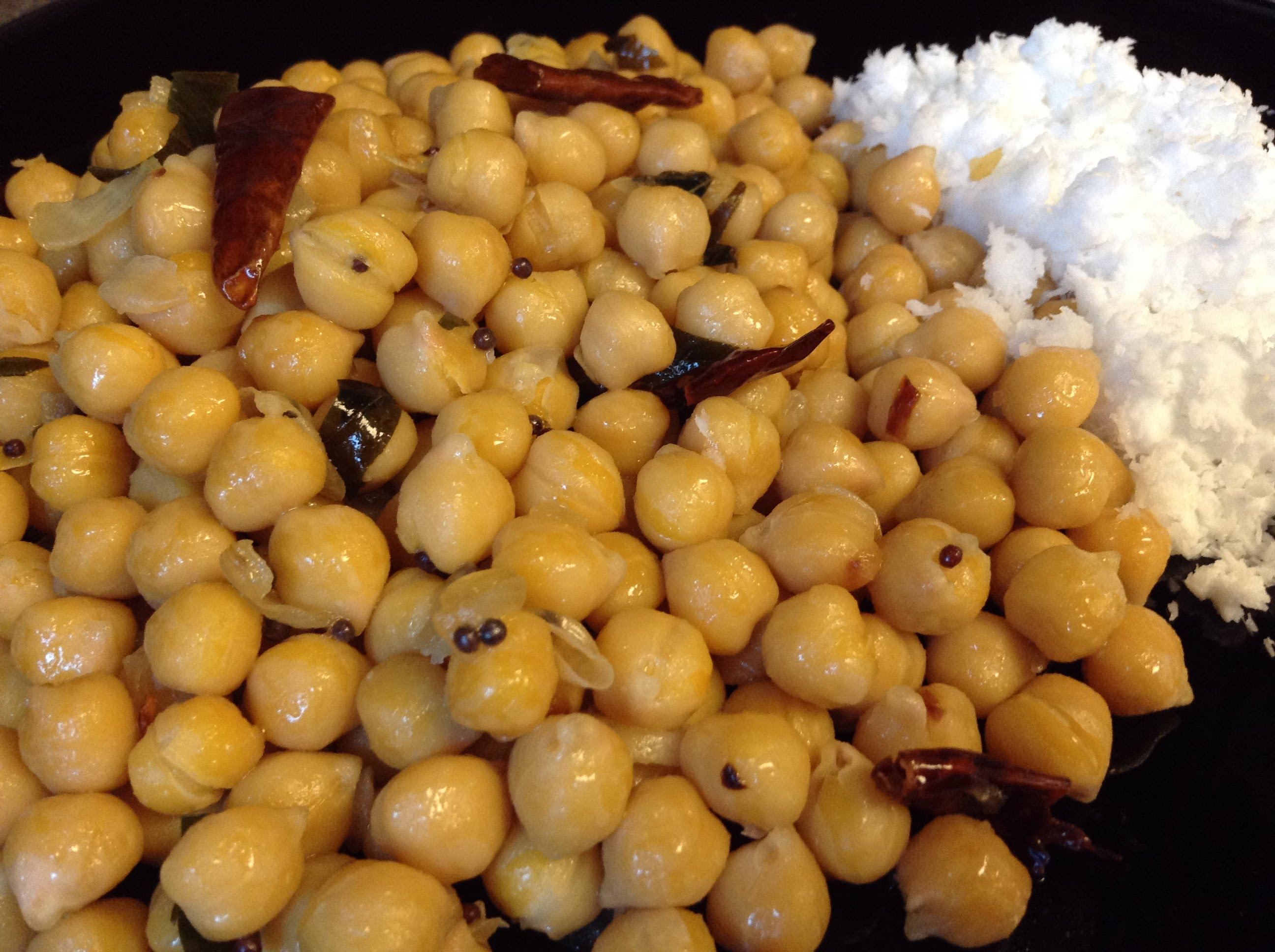 <br/>Fried chickpea mix with Green coconut sambol<br/><br/>Ingredients<br/>Chickpeas, Coconut oil, Scraped coconuts, Green chillies, Salt, Pepper, Dried red chillies, Mustard seeds, Ginger, Garlic