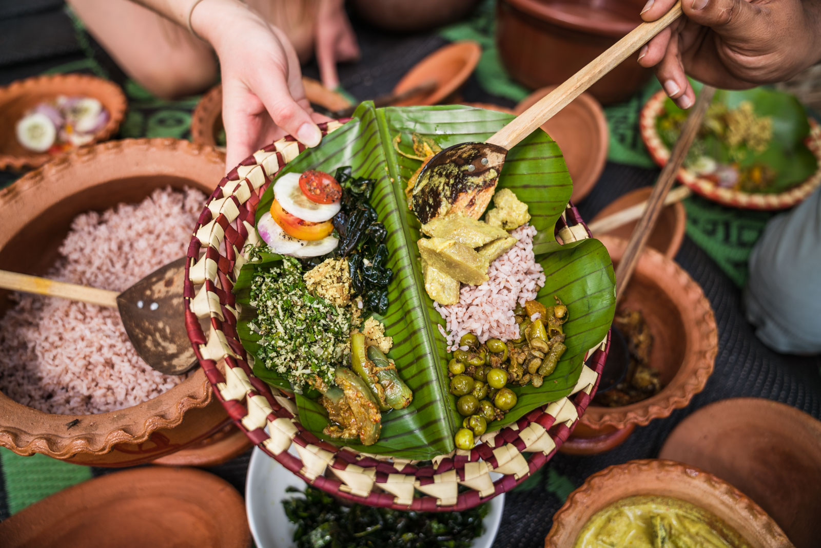 <br/>Red rice, 3 curries and sambol served on a fresh lump leaf the real Sri Lankan traditional way<br/><br/>Ingredients<br/>Red rice, Chicken curry, Cashew curry, Fried potato salad, Coconut sambol